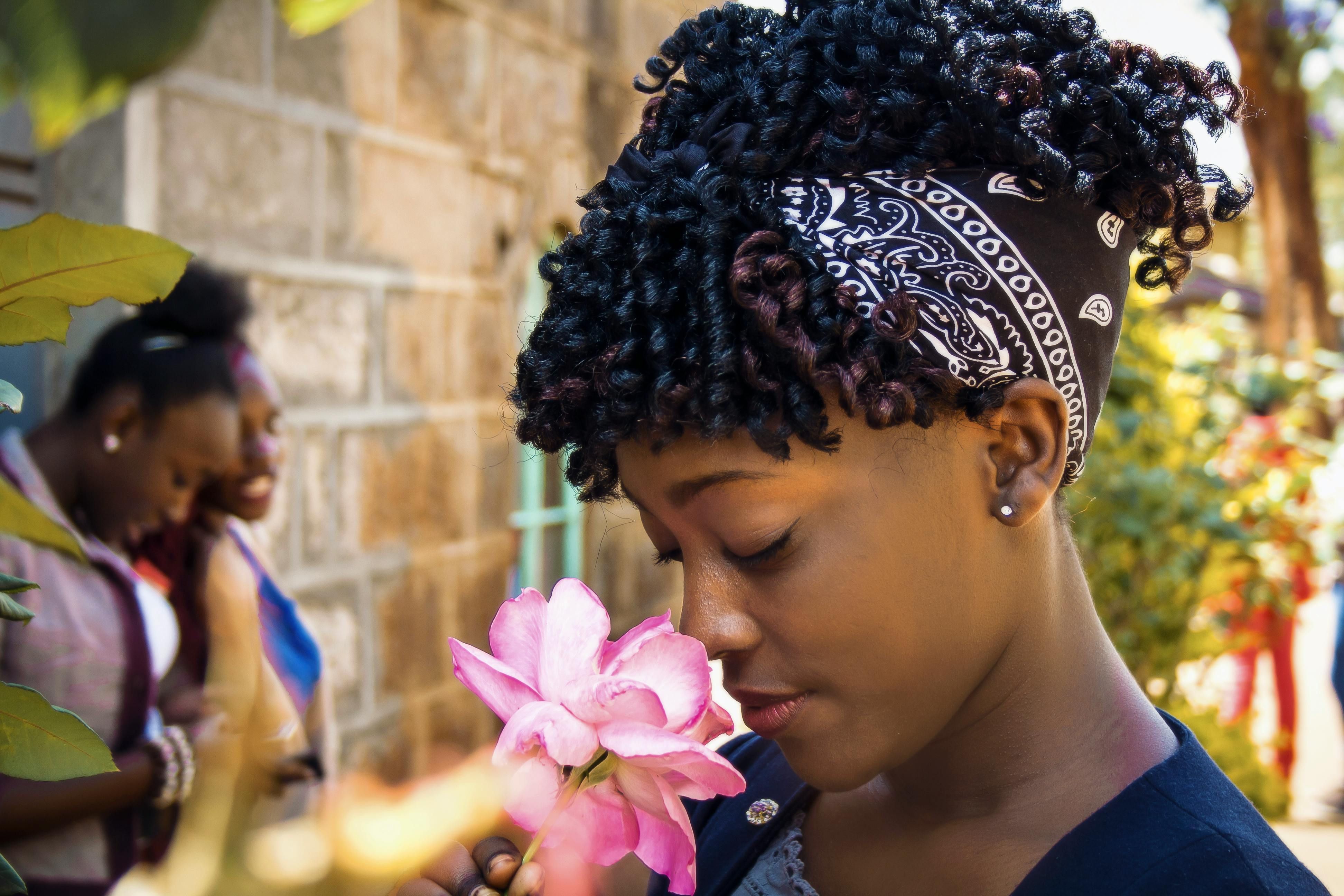 African women preparing for rest together, practicing traditional sleep customs that promote relaxation and connection.