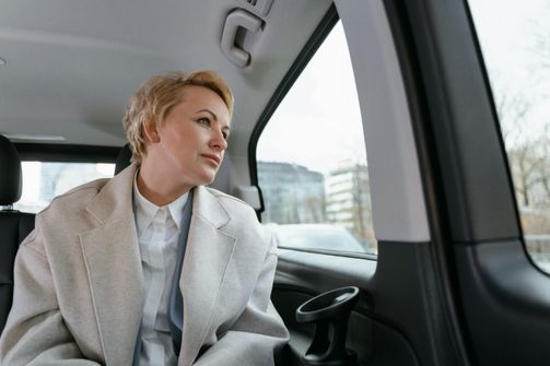 A woman on a business trip staying active and maintaining her weight loss routine, including exercising, eating healthy, and staying hydrated.