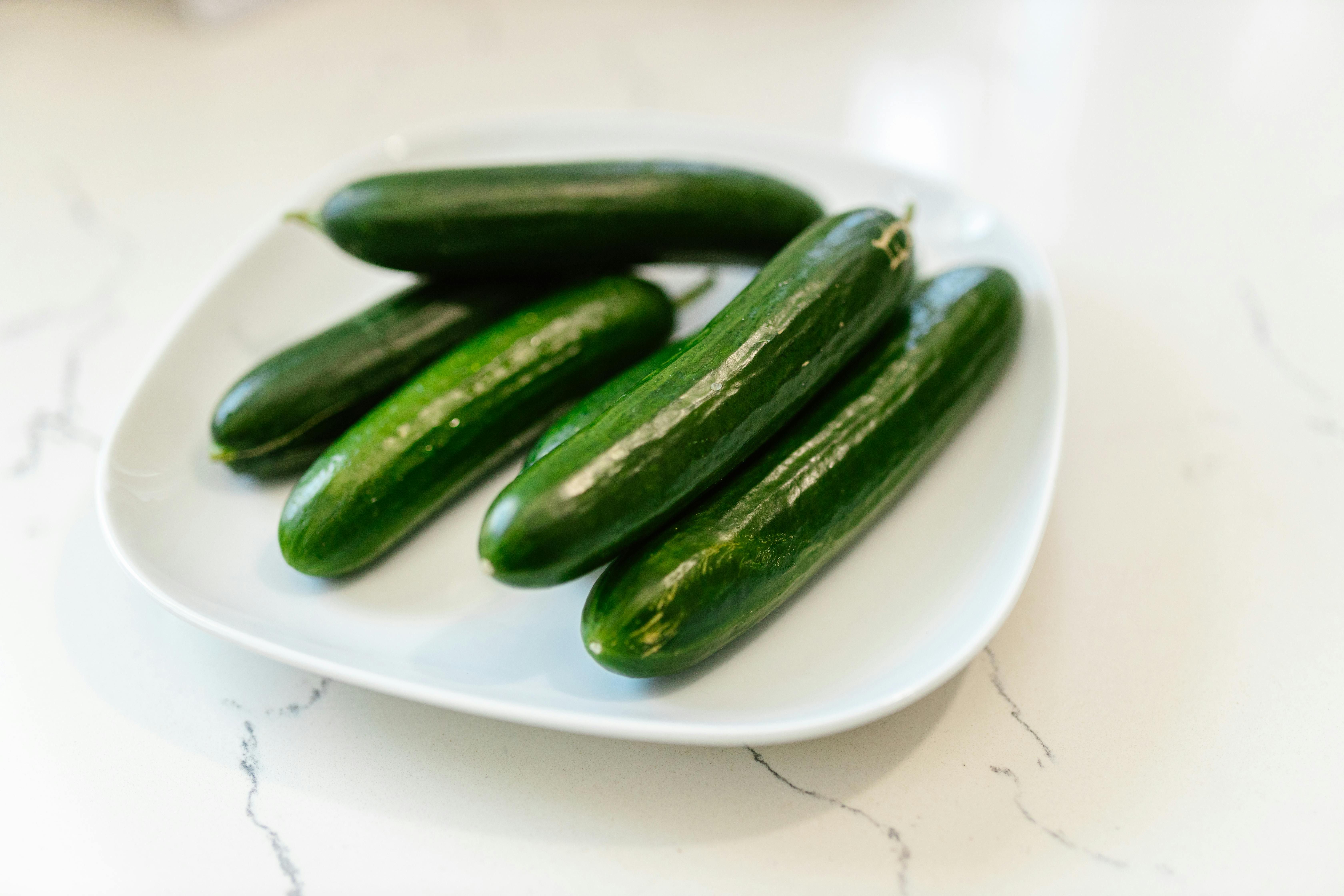 Fresh cucumbers prepared for infused water, providing hydration with added [vitamins](/blog/popular-supplements-2024) and a refreshing taste.