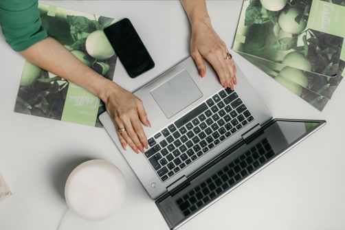 A woman engaging with an online wellness community, learning about health and fitness from supportive peers and experts.