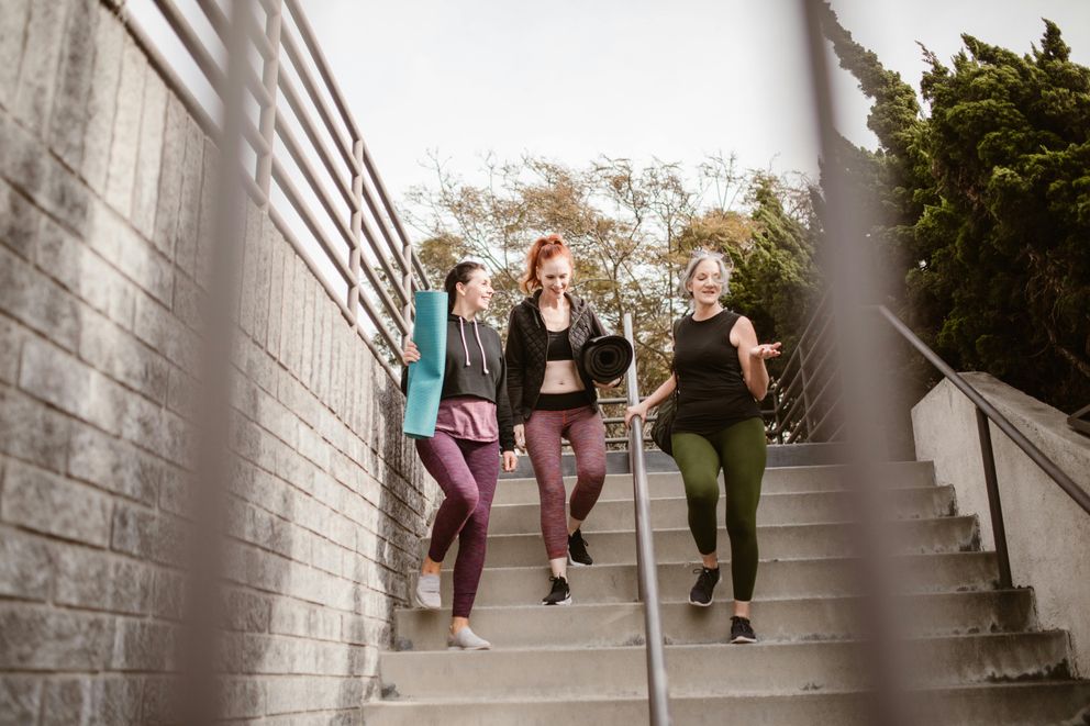 A woman experiencing different hormonal stages that influence weight loss, from puberty to menopause.