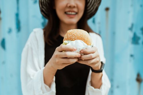 A girl with a hamburger