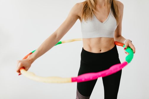 Fit woman with a hoop