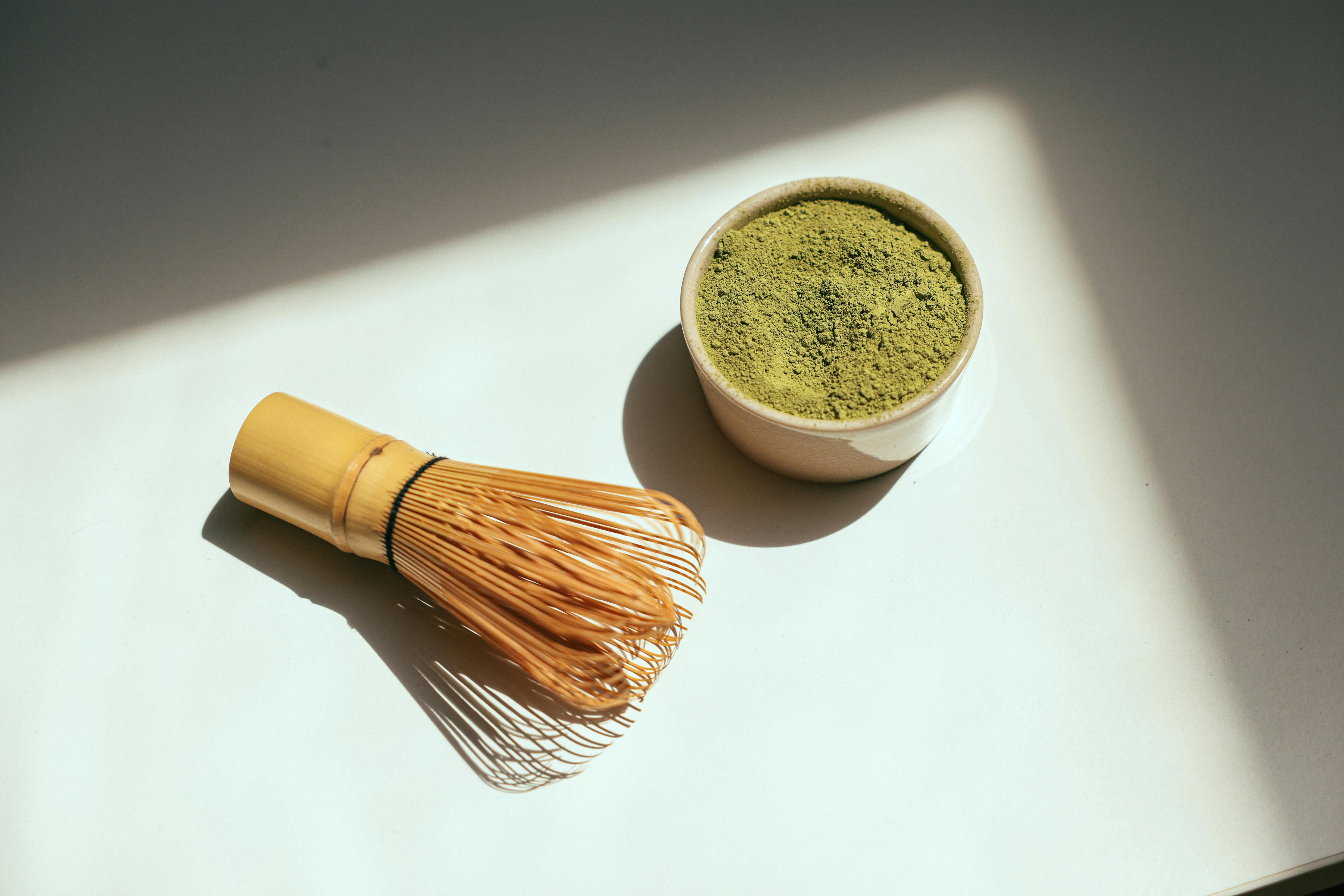 Close-up of vibrant green matcha powder, highlighting its benefits for weight loss and metabolism boosting in women.