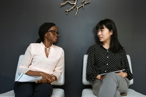 Women from diverse cultural backgrounds enjoying meals that reflect how blending different diets can support healthy weight loss.