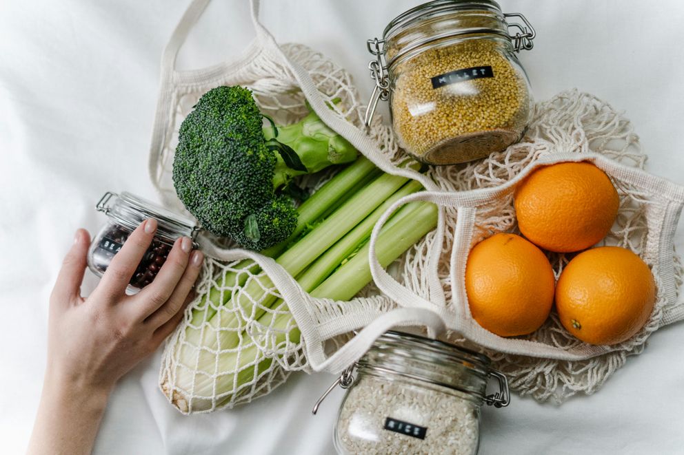 A woman is looking at healthy food that contain brain nutrients