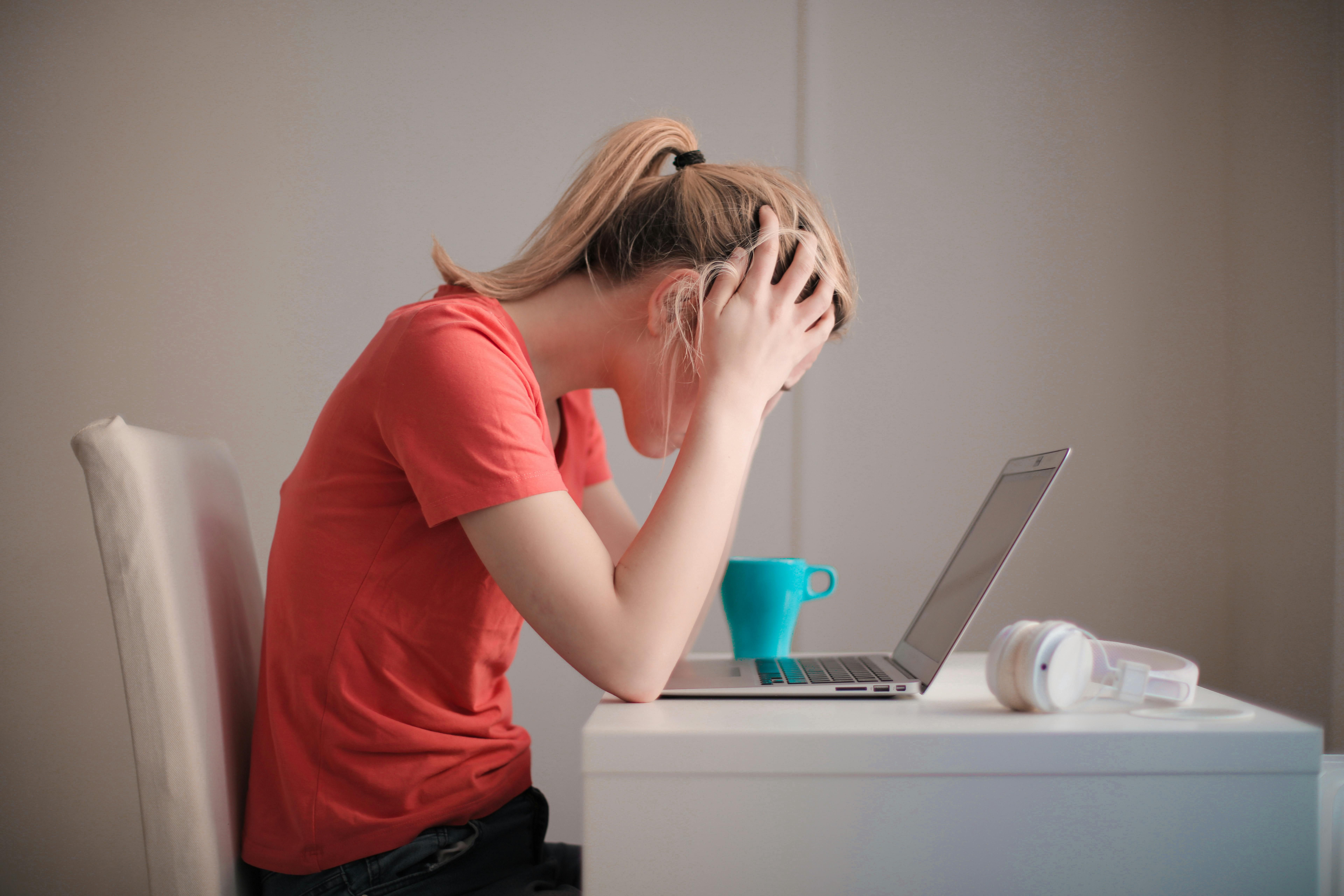 Woman focusing intently while balancing the psychological impacts of Adderall and intermittent fasting.