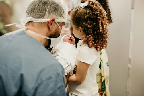 A postpartum mother practicing gentle, safe exercises and healthy eating habits to support weight loss after a C-section.