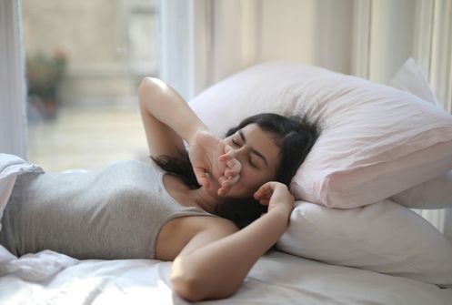 Woman experiencing fatigue and drowsiness, a common symptom of sleep apnea