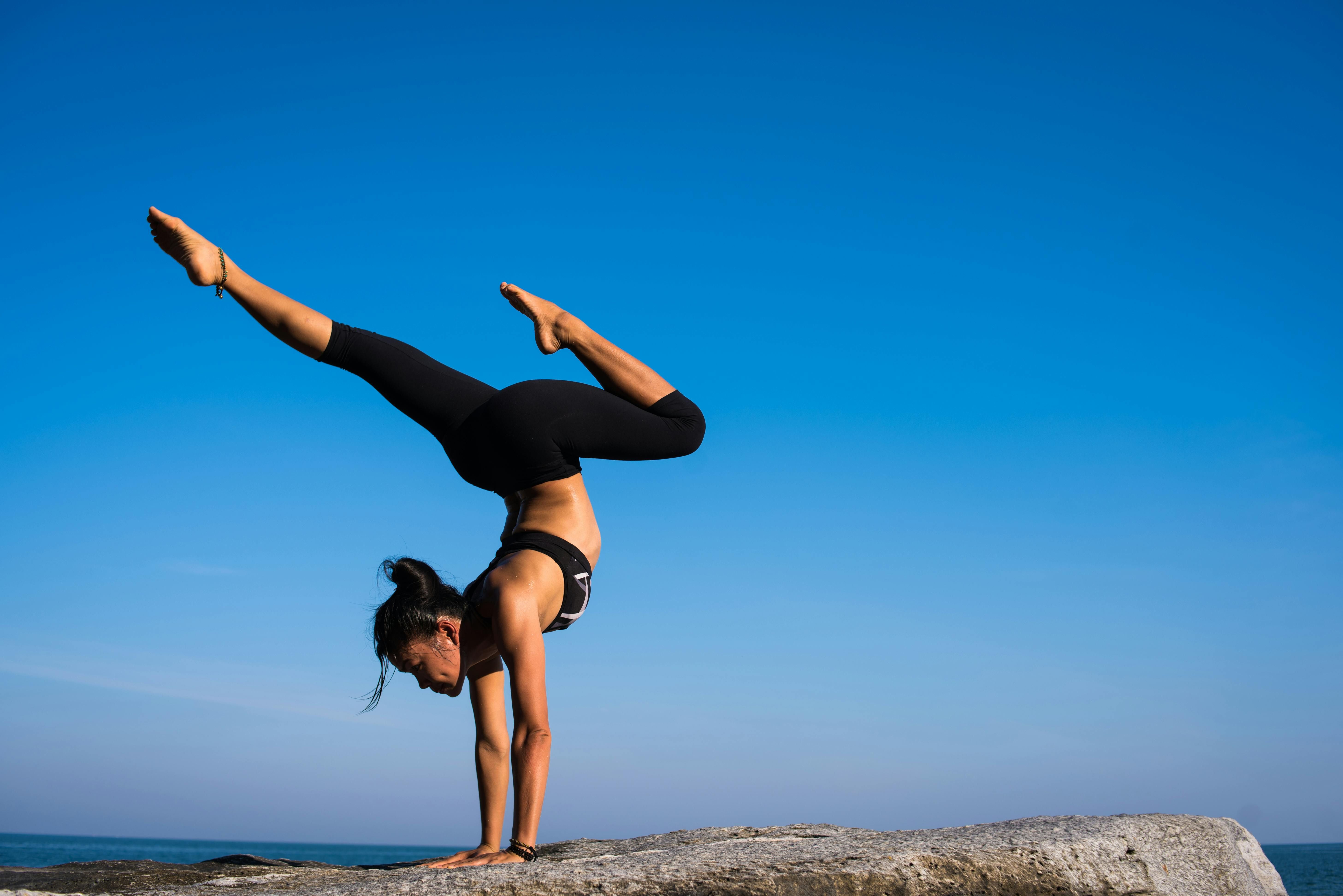 A woman practicing yoga, focusing on flexibility and mindfulness.