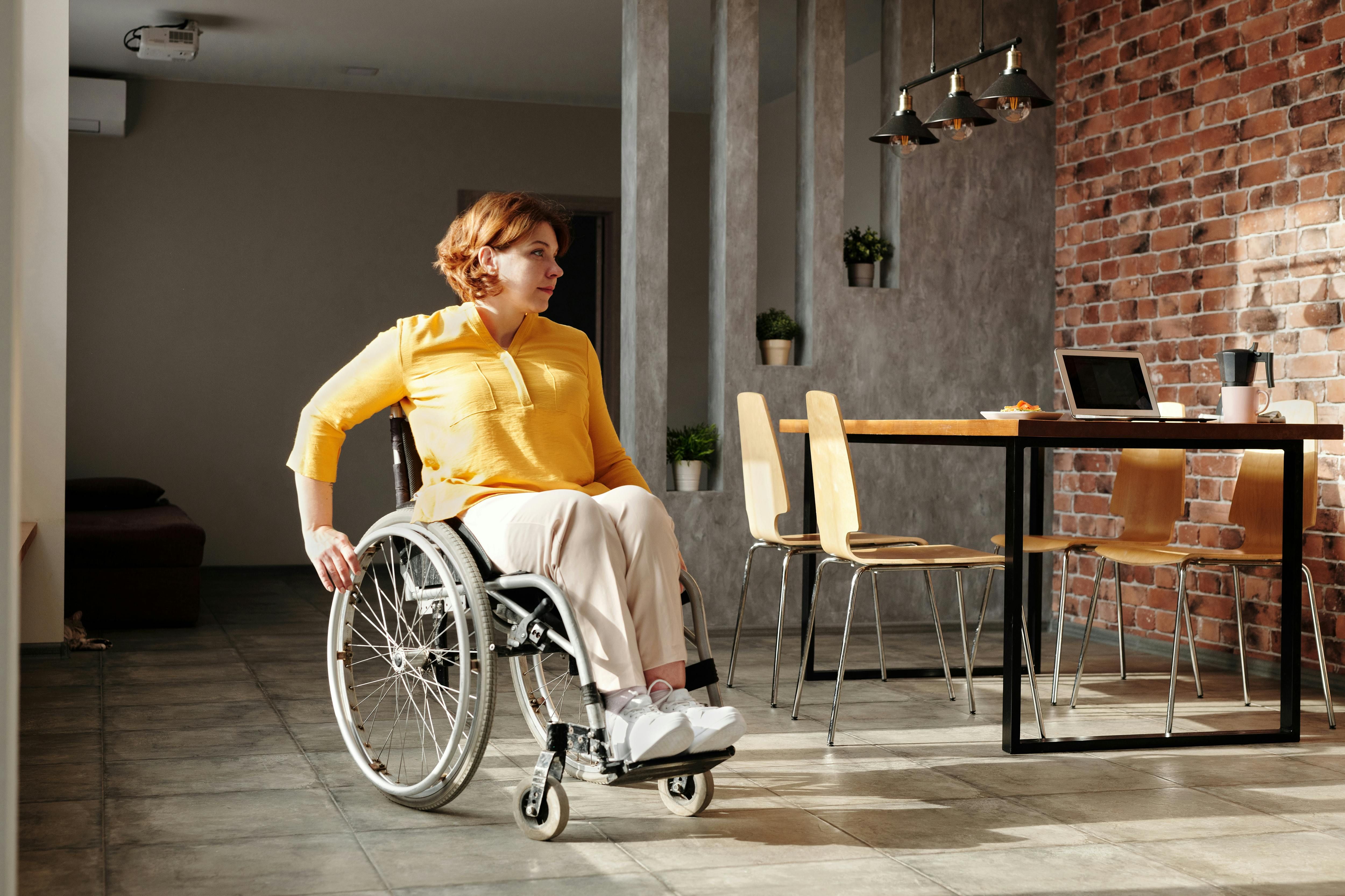 A woman in a wheelchair preparing for a workout, showing that exercise is accessible for people with mobility challenges.