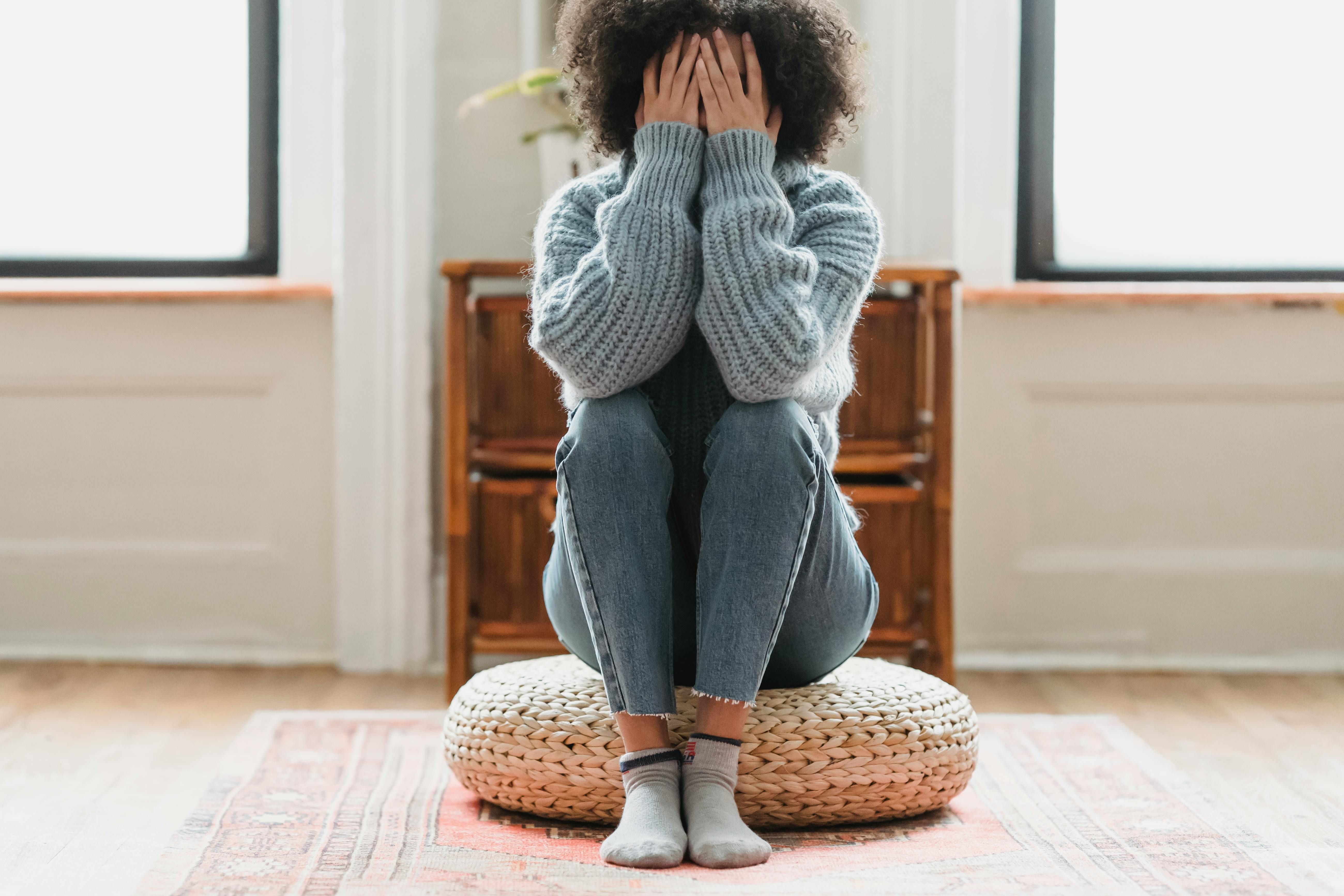 Stressed woman feeling overwhelmed with managing cortisol and weight loss