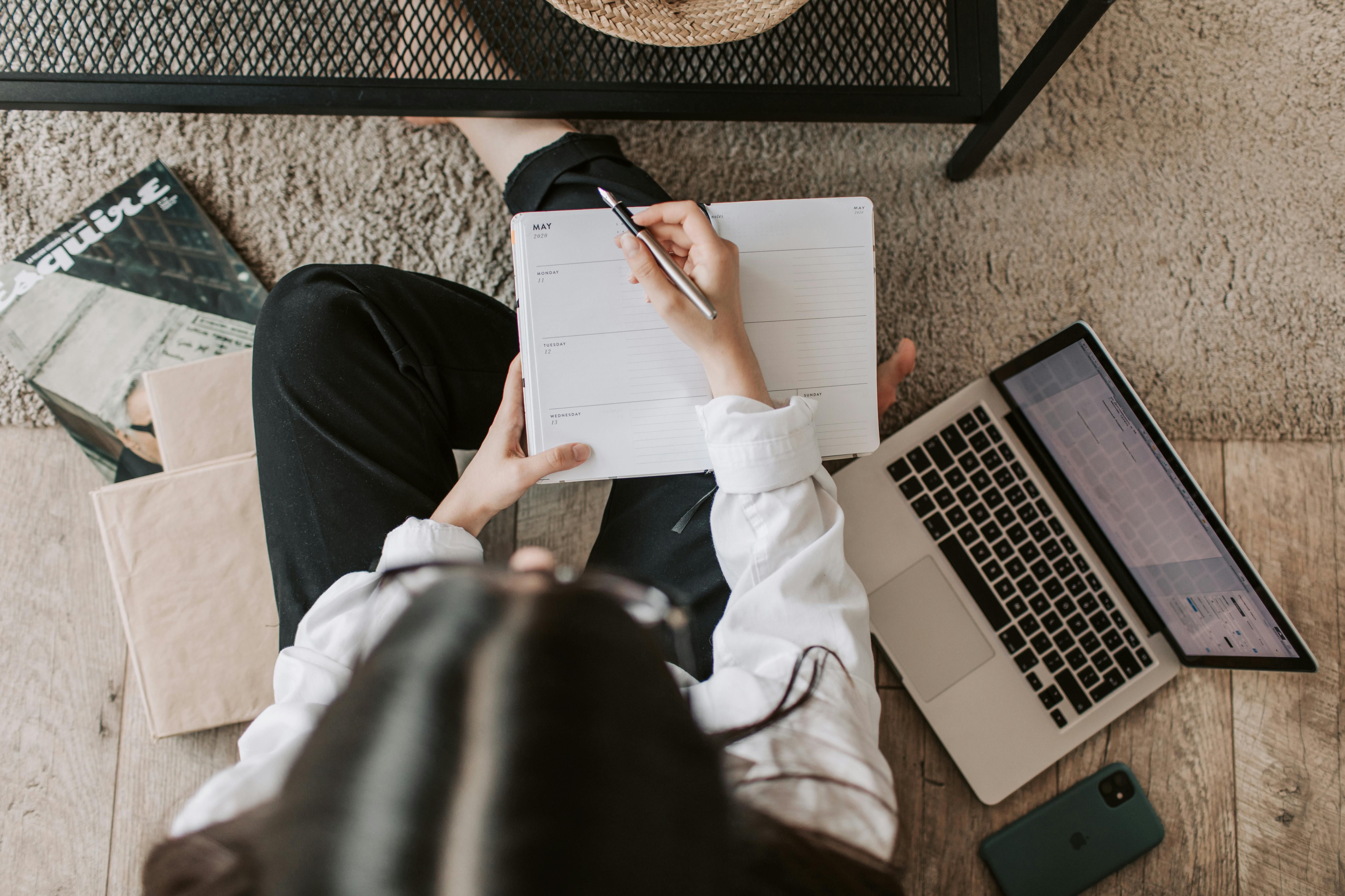 A woman with ADHD planning her day, using time management strategies to stay organized and reduce procrastination.